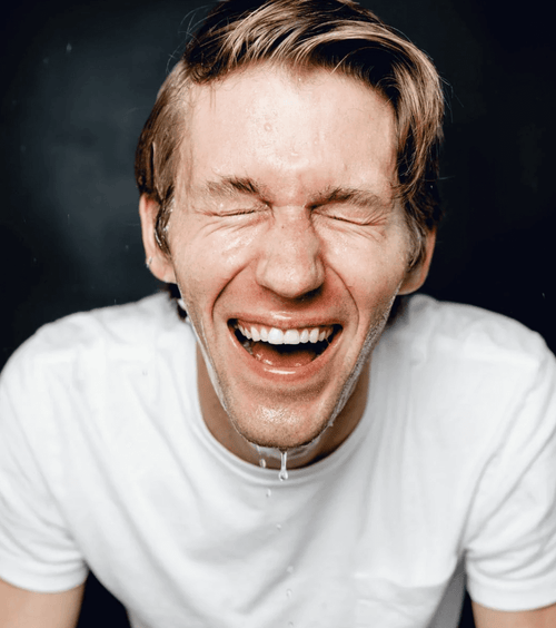 Man enjoying the feeling of the supply face wash on him