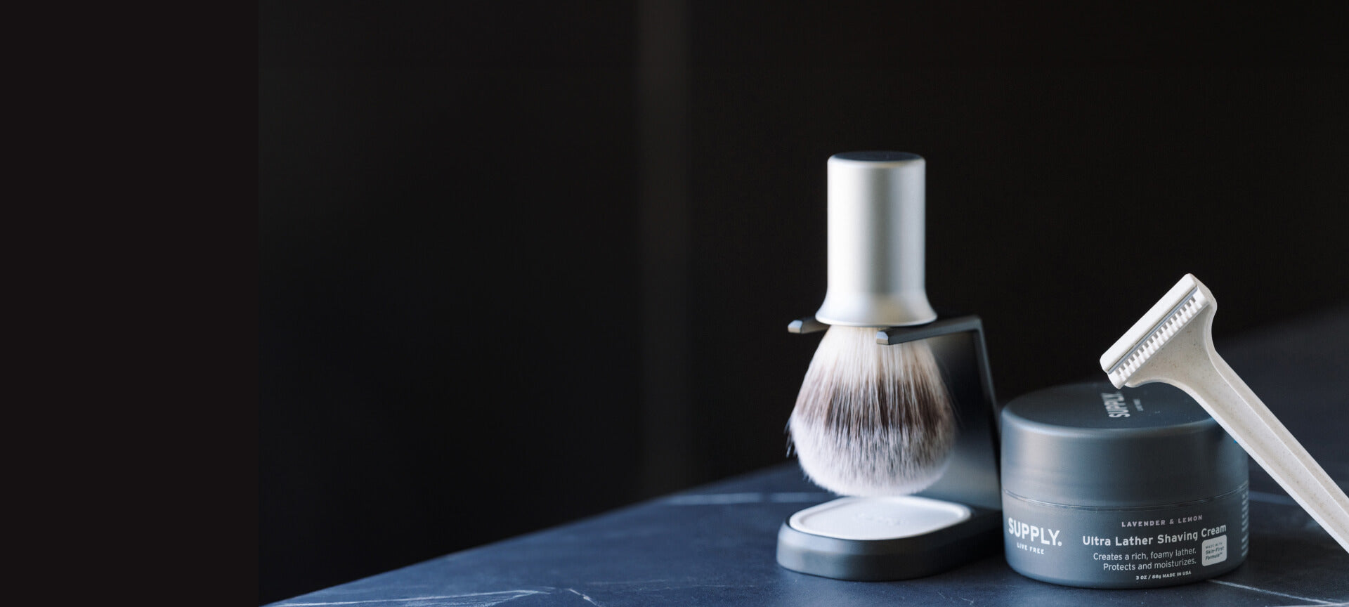 A man shaving using Supply co products