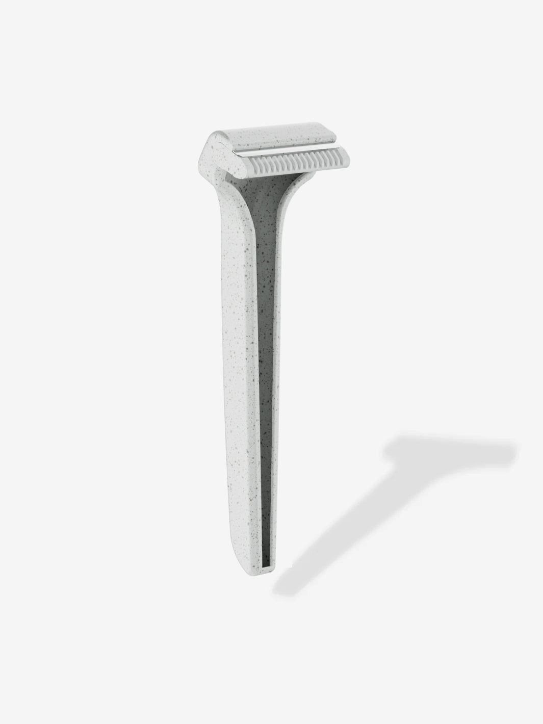 Speckled gray razor with dual blades on a light background.