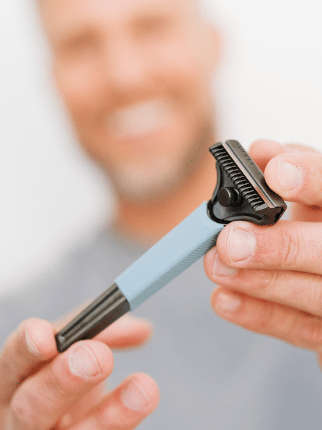 Grip Sleeve - Accessories - man holding razor with sleeve