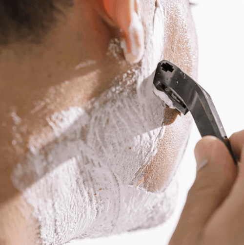 Man shaving with the supply SE razor