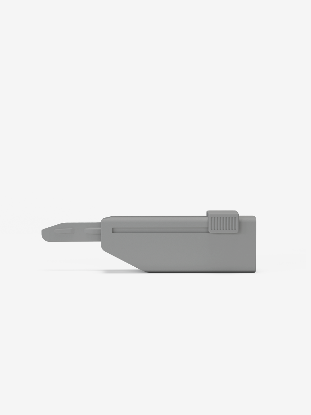 Gray plastic clipper with a sliding mechanism on a white background.