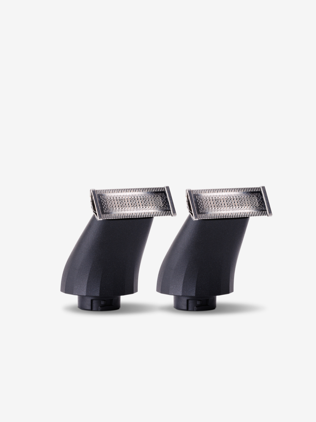 Two black trimmer heads with silver blades on a white background.