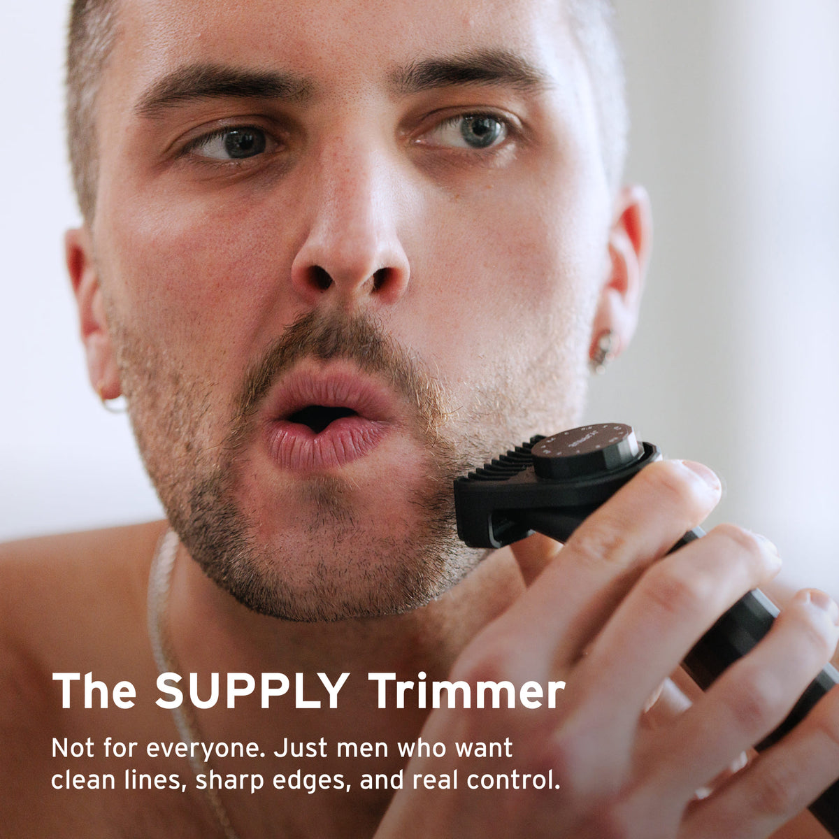 Close up of man shaving with SUPPLY Trimmer