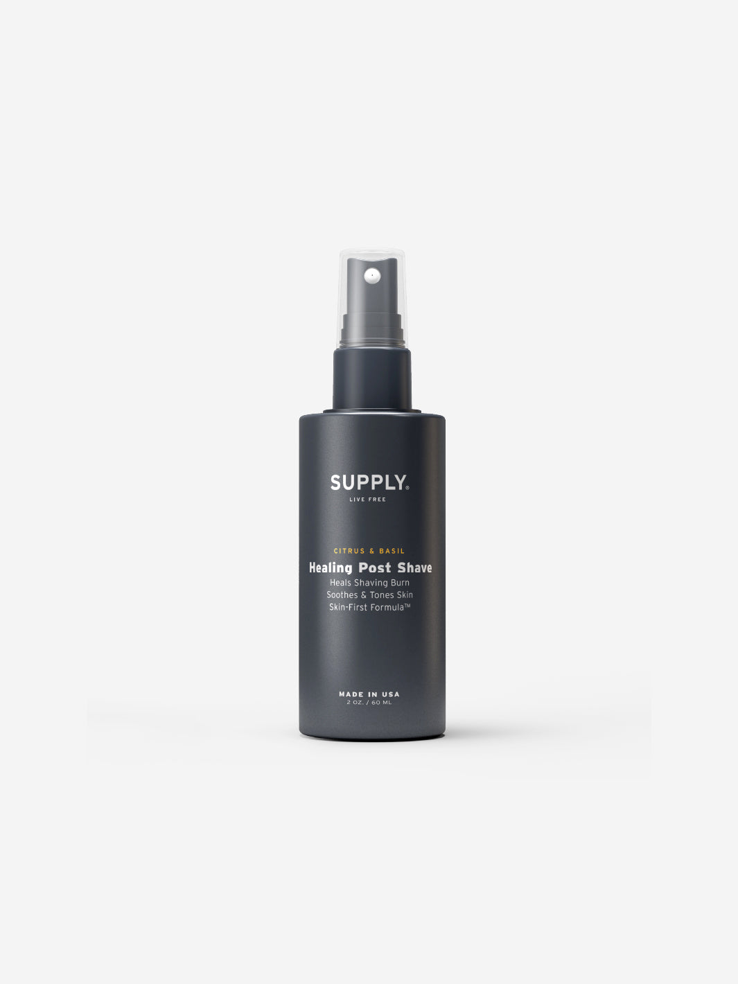 Dark gray bottle of citrus and basil healing post shave spray.