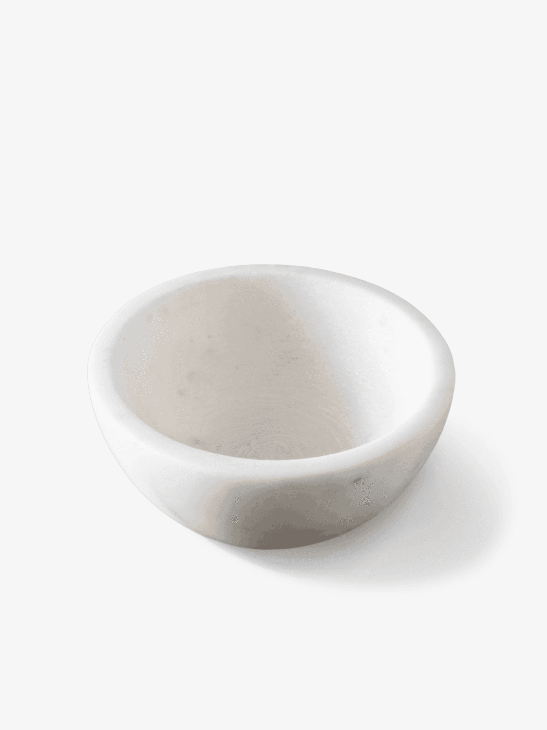 White marble bowl on a plain background.