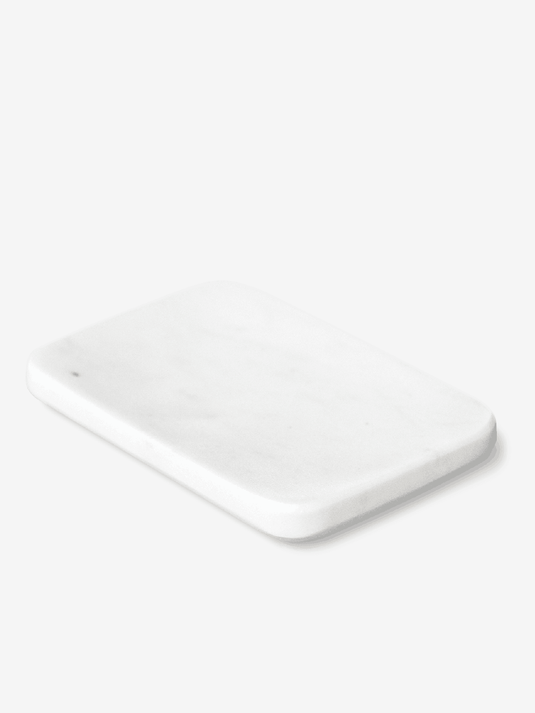 A rectangular white marble serving board on a white background.